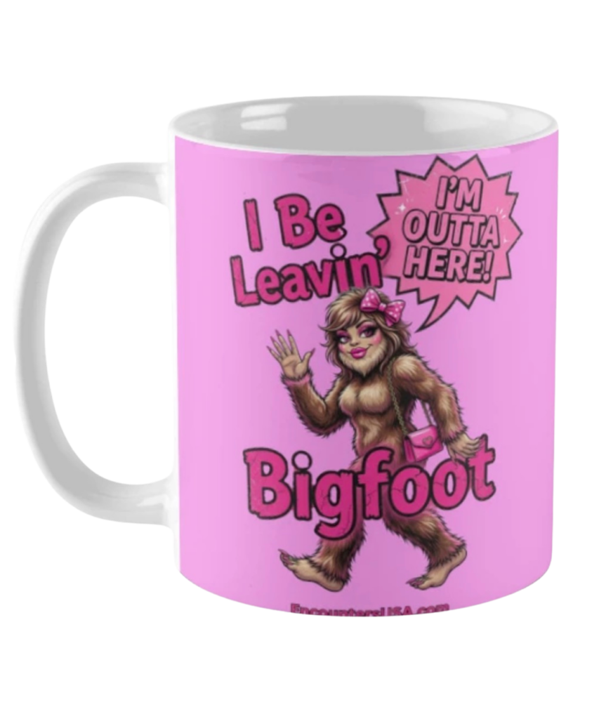 Pink and white coffee mug with sassy “I Be Leavin’ Bigfoot” glamorous Bigfoot lady design and Encounters USA branding.