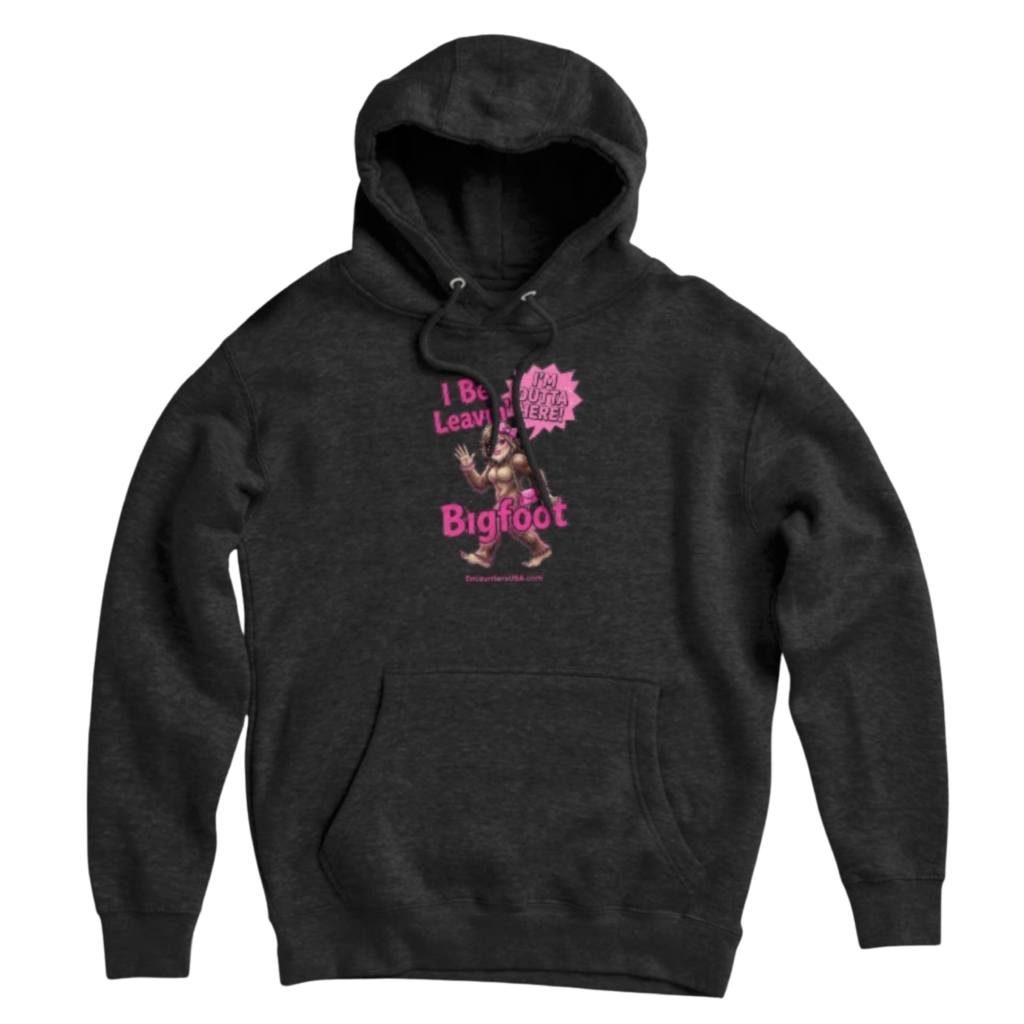 Dark gray pullover hoodie with sassy pink “I Be Leavin’ Bigfoot” design featuring a glamorous Bigfoot lady with bow and purse, Encounters USA branding.