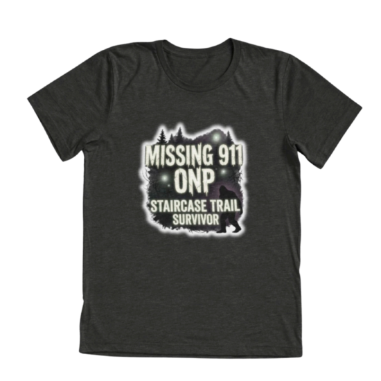 Dark gray tri-blend t-shirt with Missing 911 ONP Staircase Trail Survivor design featuring glowing forest and Bigfoot silhouette